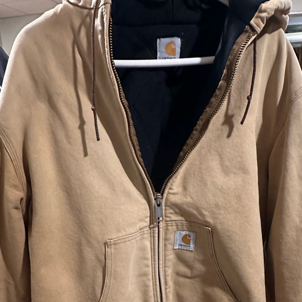 Older Carhartt jacket. Paint on the right shoulder.